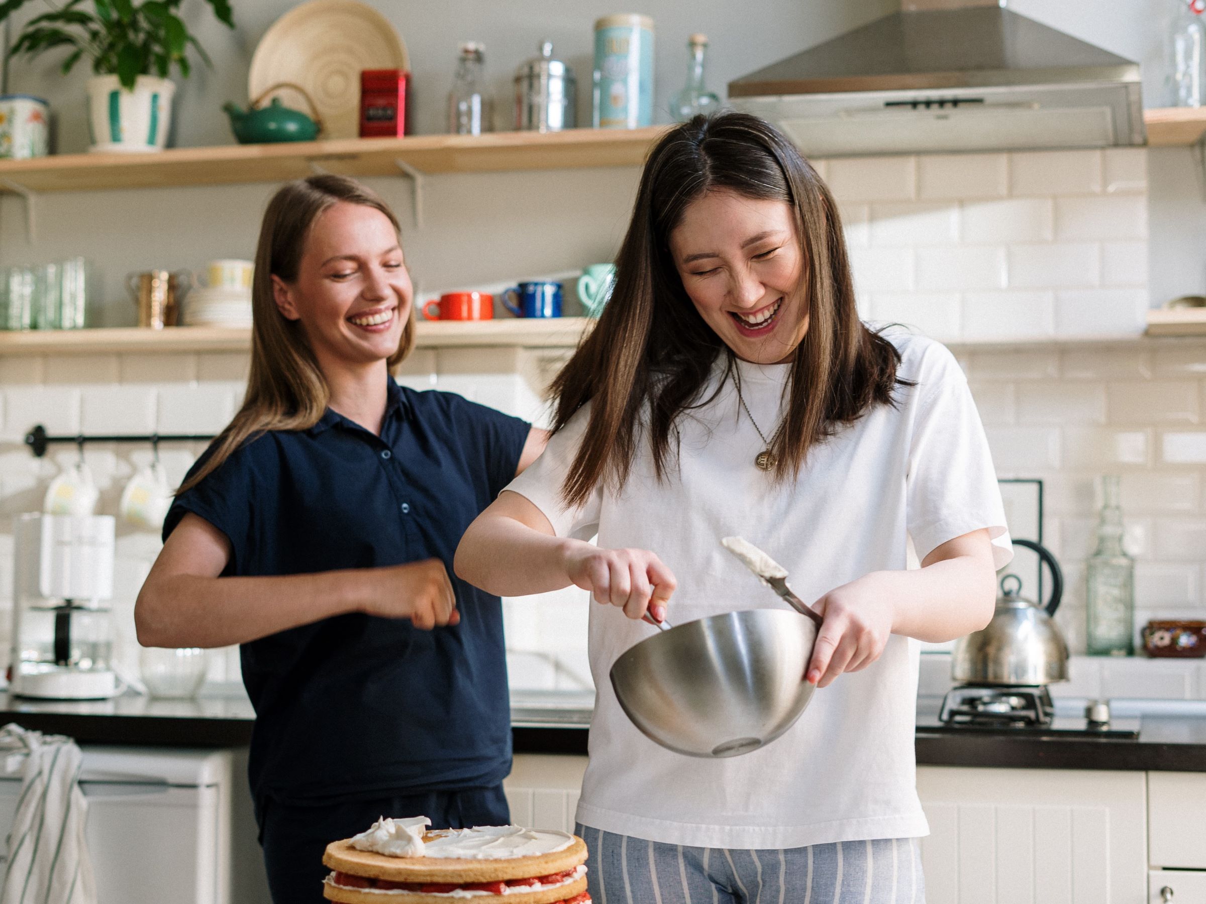 Two women baking in a kitchen