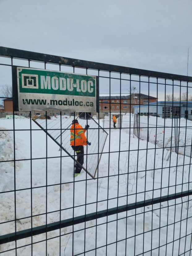 MODULOC installs fencing around the build site